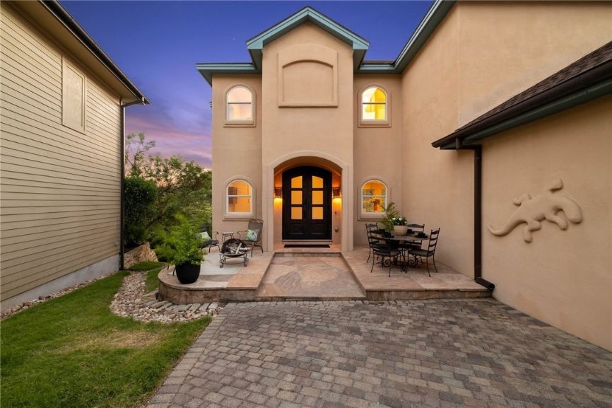 Brick Pavers Boca Raton team just finished brick pavers for a residential house in Boca Raton. In this image, you see a back of the house with the brick pavers installed in front of the house. The color of the brick is dark which blends well with the brown walls of the house. The pavers brick project was done in July of 2022 and the picture was taken by our brick paver in Boca Raton FL.